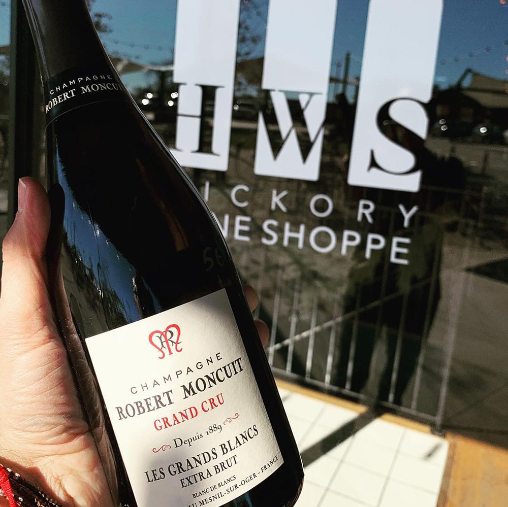 Champagne bottle in front of HWS